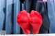 A pair of red stockings sitting on top of a table.